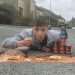 Man turns pothole into giant bowl of beans on toast